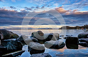 Beautiful mystical seascape with cloudy sky and sunset in the evening