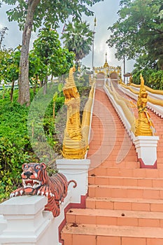 Beautiful nagas staircase upward to the temple at Wat Phra That Chom Sak, thai public Buddhist temple. Located in Mueang, Chiang