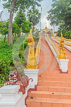 Beautiful nagas staircase upward to the temple at Wat Phra That Chom Sak, thai public Buddhist temple. Located in Mueang, Chiang