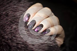 Beautiful nails on a fur background