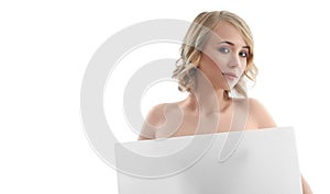 Beautiful naked woman posing with a blank copyspace banner