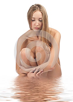 Beautiful naked woman in water