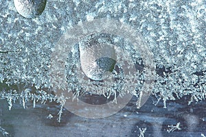 Beautiful natural background or texture of frozen transparent glass on the window in winter, strong cold concept, horizontal image