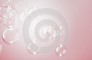 Beautiful Natural Freshness with Transparent Soap Bubbles Float on Pink Background.