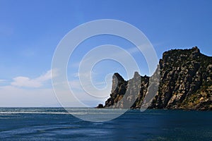 Beautiful natural landscape photo of sea and mountains with bright blue sky
