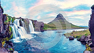 Beautiful natural magical scenery with a waterfall Kirkjufell near the volcano in Iceland. Exotic countries. Amazing places.