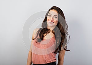 Beautiful natural makeup toothy smiling woman with long brown healthy hair style. Health care concept. Closeup portrait