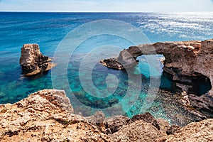 Beautiful natural rock arch near of Ayia Napa, Cavo Greco and Protaras on Cyprus island, Mediterranean Sea. Legendary bridge