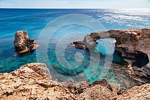 Beautiful natural rock arch near of Ayia Napa, Cavo Greco and Protaras on Cyprus island, Mediterranean Sea. Legendary bridge photo