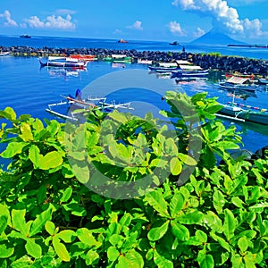 beautiful natural scenery there are fishing boats, mountains and sea