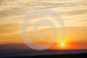 Beautiful natural textural background of the sunset on the lake, river. Salt lake Elton, sunset on the water