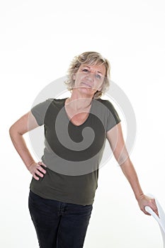 Beautiful naturally senior blond woman smiling posing looking in camera on white background