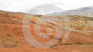 Beautiful nature of Altai - bright red mountains Kyzyl-Chin in summer. Panoramic view of the desert and mountain area