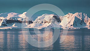 Beautiful nature. Antarctic landscape. Icebergs, glaciers and mountains at sunset. Climate change, global warming