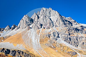 Mountain peaks with talus slope underneath photo