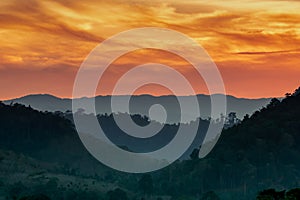 Beautiful nature landscape of mountain range with sunset sky and clouds. Mountain valley in Thailand. Scenery of mountain layer