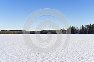 Beautiful nature and landscape photo of lake with ice and snow in Sweden Scandinavia