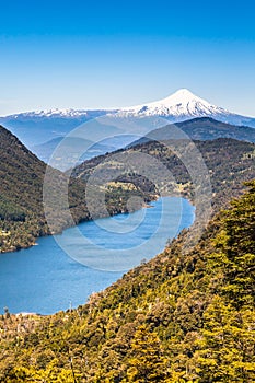 The beautiful nature of Patagonia forests the volcano of the river and lake through the sunset