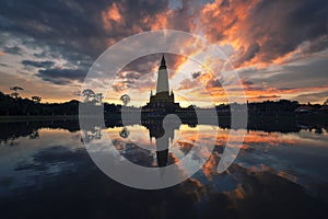 Beautiful nature with sunrise reflection on water at Wat Bang Thong ,famous temple in Krabi, Thailand