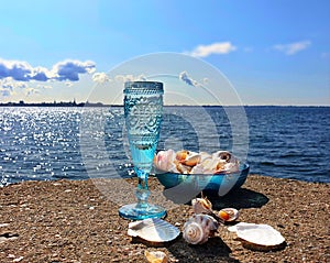 Beautiful nature vacation  romantic  summer  at sunset seascape two blue glasses of Champagne  living  coral blue white color wild