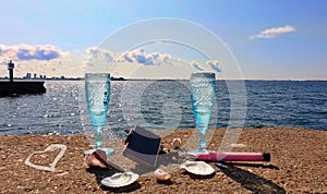Beautiful nature vacation  romantic  summer  at sunset seascape two blue glasses of Champagne  living  coral blue white color wild