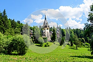 Beautiful neo-Renaissance building of Peles Castle Castelul Peles near Bucegi Mountains Muntii Bucegi in a sunny summer day in