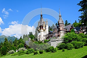 Beautiful neo-Renaissance building of Peles Castle Castelul Peles near Bucegi Mountains Muntii Bucegi in a sunny summer day in