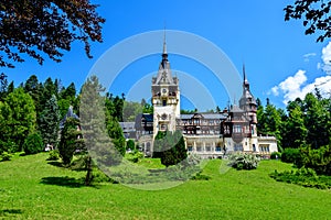 Beautiful neo-Renaissance building of Peles Castle Castelul Peles near Bucegi Mountains Muntii Bucegi in a sunny summer day in