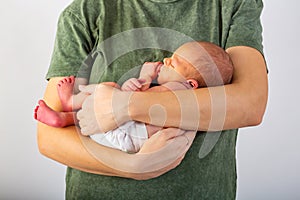 Beautiful new born baby resting on mom`s hands