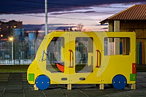 Beautiful new modern playground in kindergarten with soft rubber flooring and bright new multicolored big toy car