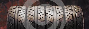 Beautiful new summer tires with a directional sports tread pattern for auto racing and Motorsport. reddish fire