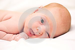 Beautiful newborn baby winking