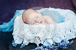 Beautiful newborn sleeping baby boy