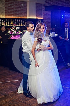 Beautiful newlywed couple first dance at wedding
