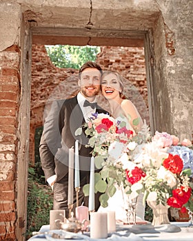 Beautiful newlyweds on the background of an ancient castle.