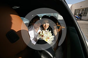 Beautiful newlyweds in the car