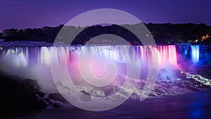 Beautiful Niagara Falls lit by colorful night lights