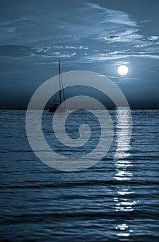 Beautiful night Adriatic sea, yacht and full moon, Croatia. Night seascape