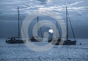 Beautiful night Adriatic sea, yachts and full moon, Croatia. Night seascape