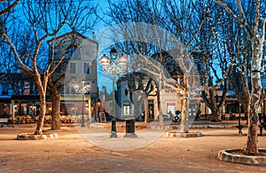 Beautiful night cityscape, tree illumination, lights and benches