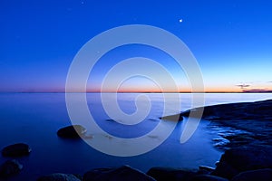 Blue moment in the rocky seashore