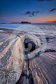 Blue moment in the rocky seashore