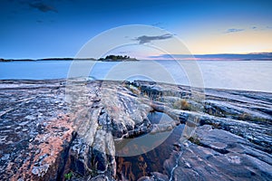 Blue moment in the rocky seashore