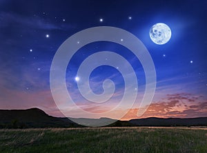 Beautiful night sky with the full moon and stars photo