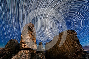 A beautiful night sky photograph with moving circular star trails