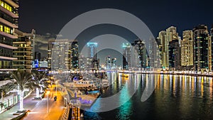 View of Dubai Marina Towers and yahct in Dubai at night timelapse hyperlapse