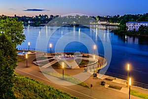 Beautiful night view of Narva. River promenade and the square of the sun