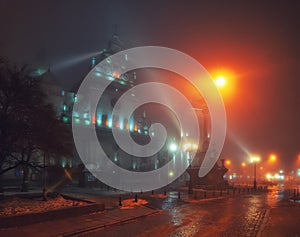 Beautiful nightscape of Bernardine church and monastery in historical city center at foggy night, Lviv, Ukraine