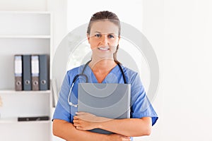Beautiful nurse holding a folder