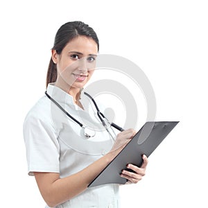 Beautiful nurse smiling and taking notes photo